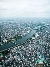 High angle view of city buildings against sky