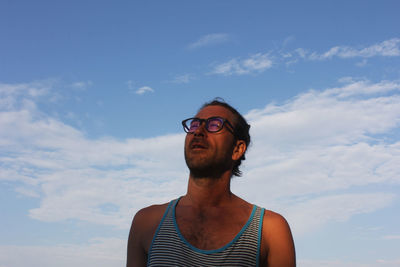 Low angle view of man standing against sky