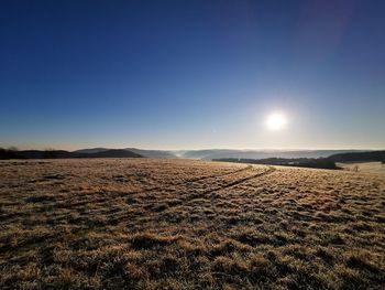 Scenic view of land against clear sky