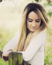 Beautiful young woman looking down