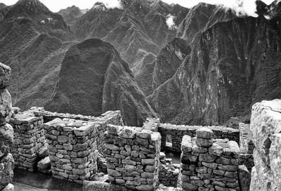 Stone wall of machu picchu against mountains
