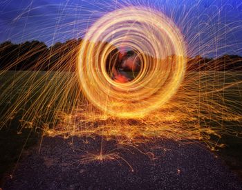 Light trails against sky at night