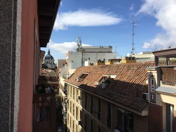 View of city buildings against sky