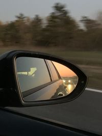 Reflection of car on side-view mirror