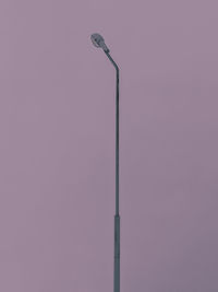 Low angle view of street light against sky