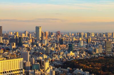 Cityscape against sky during sunset