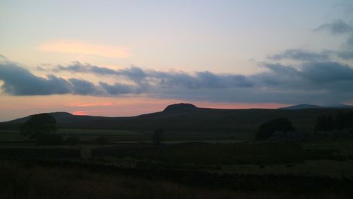 Scenic view of silhouette landscape against sky during sunset