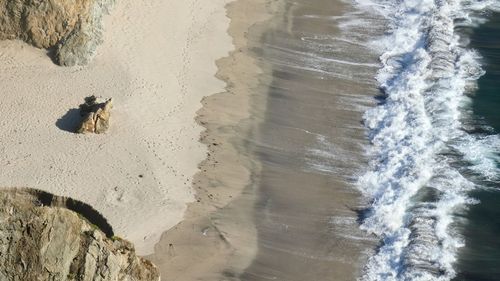 High angle view of waves on beach
