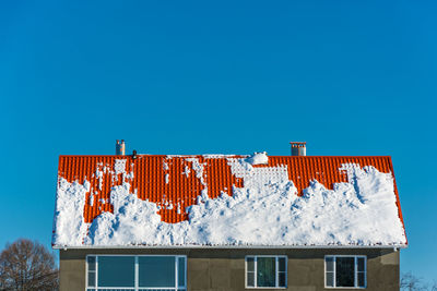 Low angle view of building against clear blue sky