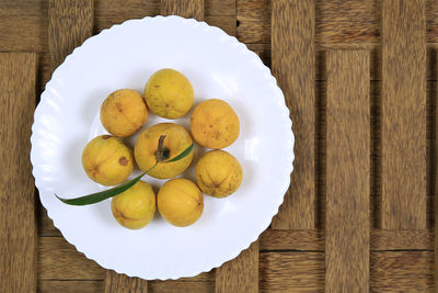 High angle view of fruits in bowl on table