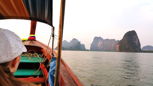 Boat sailing on sea against sky