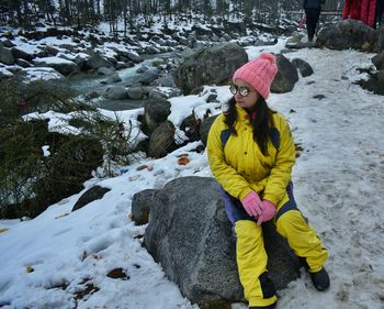 Full length of child in snow during winter