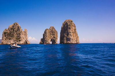 Panoramic view of sea against clear blue sky