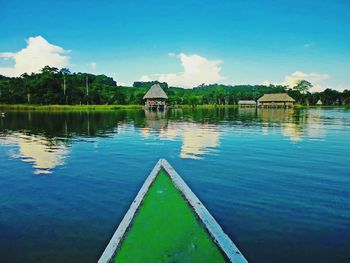 Scenic view of swimming pool by lake against sky