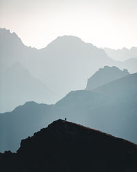 Scenic view of silhouette mountains against sky