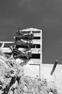 Abandoned construction site against sky
