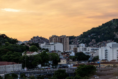 High angle view of buildings against sky at sunset