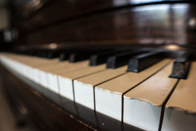 Close-up of chipped piano keys on old  sentimental piano