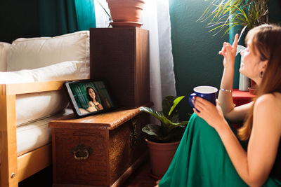 Woman talking to friend on video call