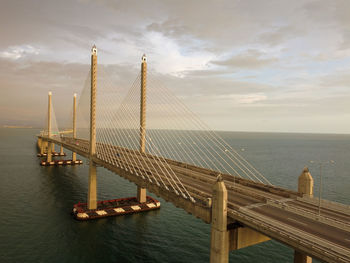 Bridge over sea against sky