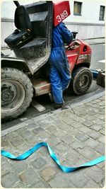 Full length of woman standing by railing