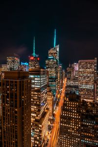 Illuminated buildings in city at night