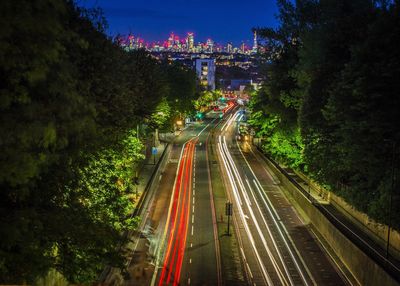 High angle view of light trails on road in city