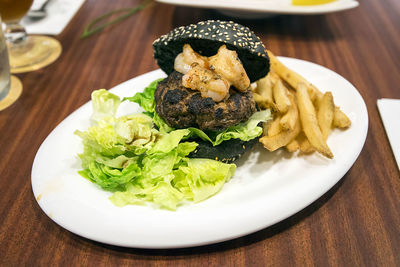 Close-up of burger served in plate on table