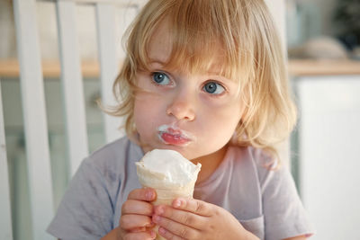 Close-up of young woman holding ice cream
