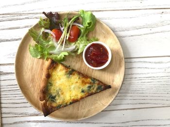 High angle view of pizza in plate on table