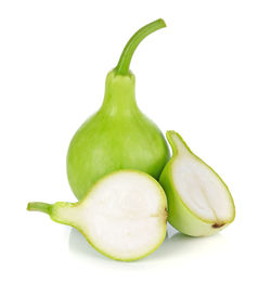 Close-up of green chili pepper against white background