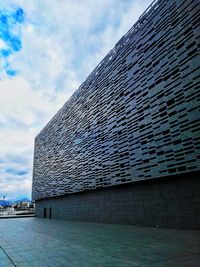 Low angle view of modern building against sky