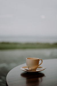 Close-up of coffee cup on table