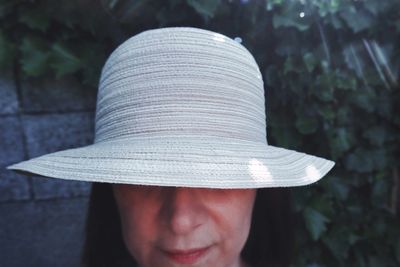 Close-up of woman wearing hat