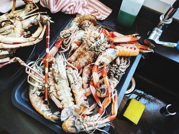 High angle view of meat on barbecue grill