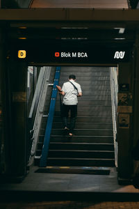 Rear view of man on subway station