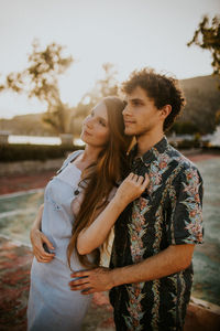 Young couple standing outdoors