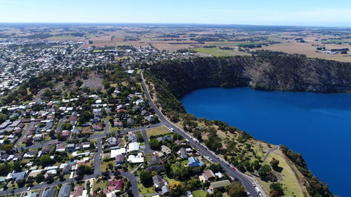 High angle view of buildings in town against sky