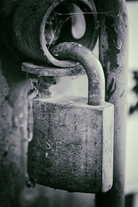 Close-up of padlocks on metal