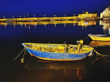 Scenic view of river against sky at night