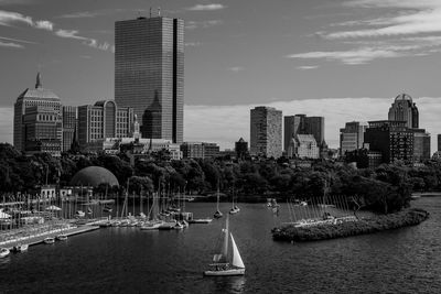 City at waterfront against sky