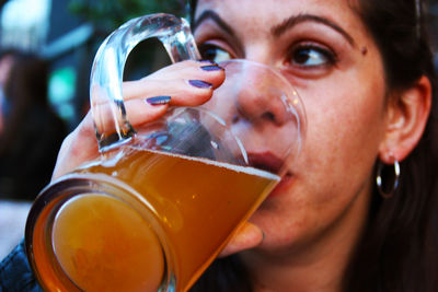 Close-up portrait of a man drinking glass