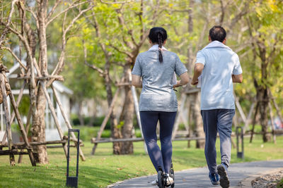 Couple workout and exercise with scooter together outdoor in park person