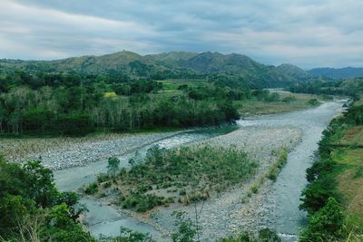 Scenic view of river flowing through mountains