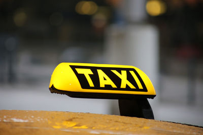 Close-up of information sign on taxi