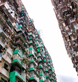 Low angle view of buildings against clear sky in city