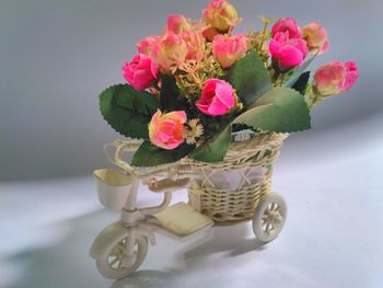 Close-up of pink flower vase on table