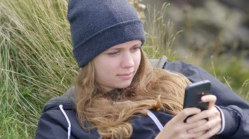 Portrait of mature man using mobile phone