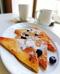 Delicious french toast with blueberry in white plate ready to be served for breakfast
