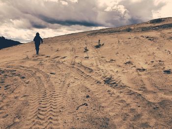 Rear view of man walking on land